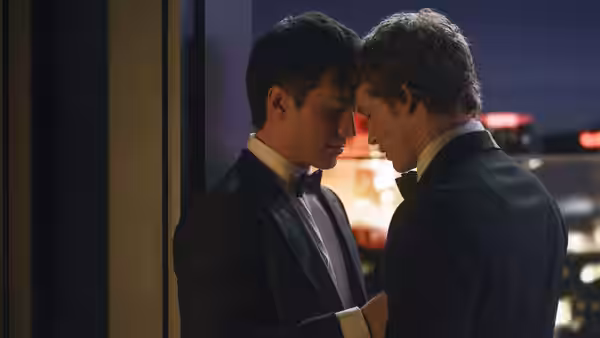 Shane Hollander and Ilya Rozanov press foreheads together in tuxedos