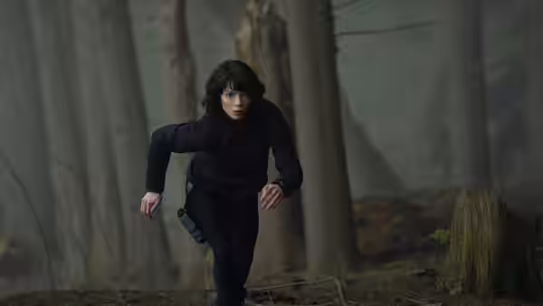 Drasa (Anya Taylor-Joy) running through a misty forest at night