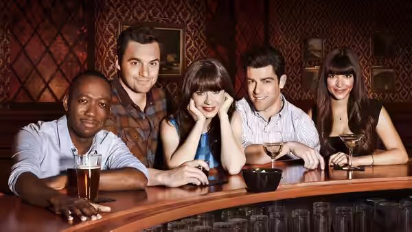 Winston, Nick, Jess, Schmidt and Cece seated at a wooden bar counter