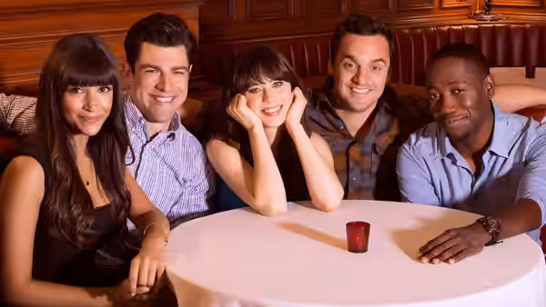 Jess, Nick, Cece, Schmidt and Winston smiling around a round table