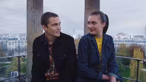 Murphy (Karl Glusman) and Omi (Klara Kristin) on a balcony overlooking the city