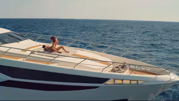 Laura Biel (Anna-Maria Sieklucka) lies atop Don Massimo Torricelli (Michele Morrone) on a yacht deck