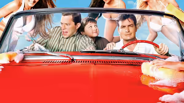 Charlie Harper, Alan Harper and Jake Harper in a red convertible at car wash