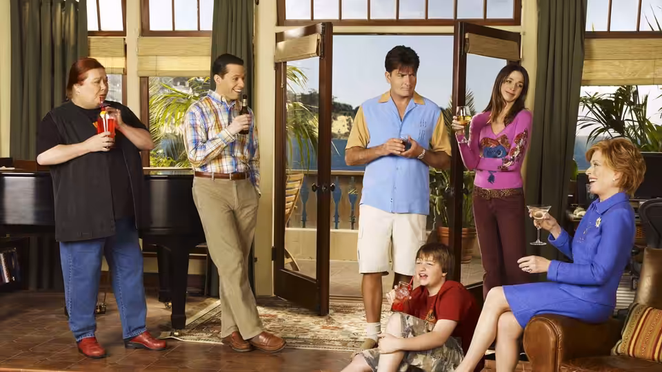 Berta, Alan, Charlie, Rose, Evelyn and Jake holding drinks in the living room