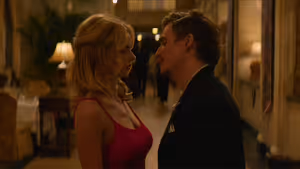 Caroline Daniels (Samara Weaving) and Oliver Anderson (Kyle Gallner) face each other closely in a hotel hallway