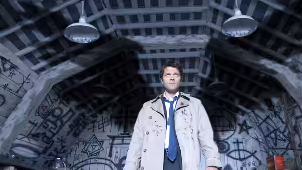 Castiel (Misha Collins) standing in a room covered with occult symbols