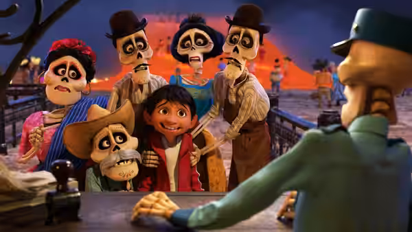Miguel stands with skeleton relatives before a station clerk at the desk