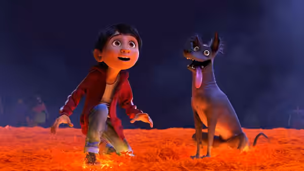 Miguel kneels on glowing ground staring at a wide-eyed dog