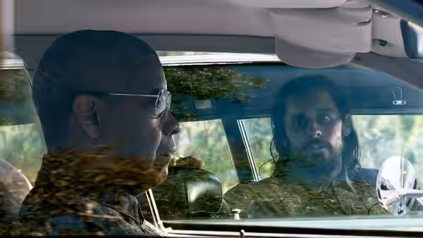 Denzel Washington drives while Jared Leto rides in the passenger seat