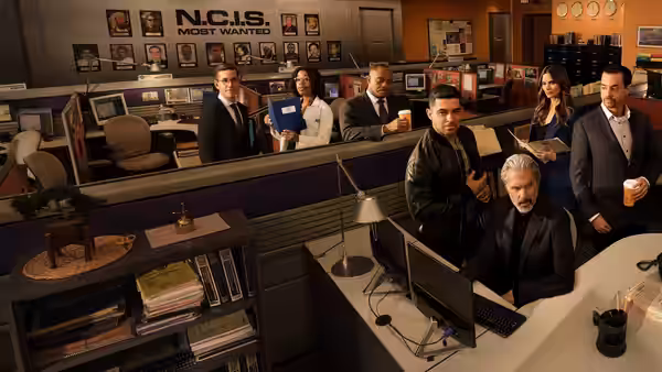 Leroy Jethro Gibbs (Mark Harmon) at his computer in the squad room