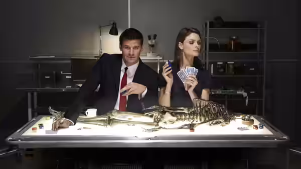 Booth (David Boreanaz) and Brennan (Emily Deschanel) examine a skeleton on a lab table