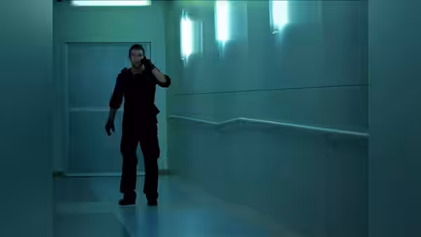 Lucas Hood (Antony Starr) speaking on a phone in a corridor