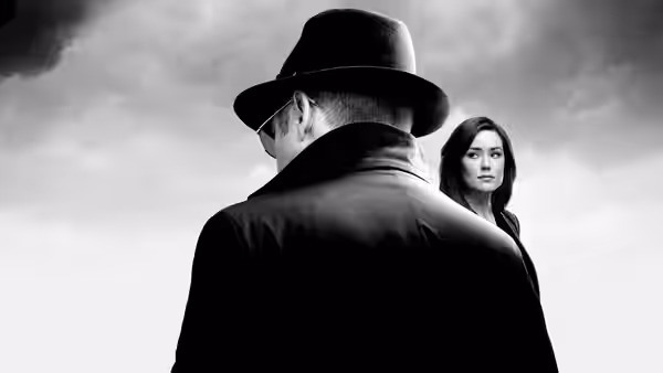 Raymond 'Red' Reddington (James Spader) standing beside Elizabeth Keen (Megan Boone) under stormy sky