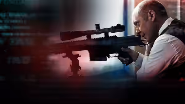 a man aiming a large sniper rifle in front of digital screens