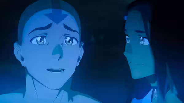 Aang and Katara gaze at each other in close-up with blue glow
