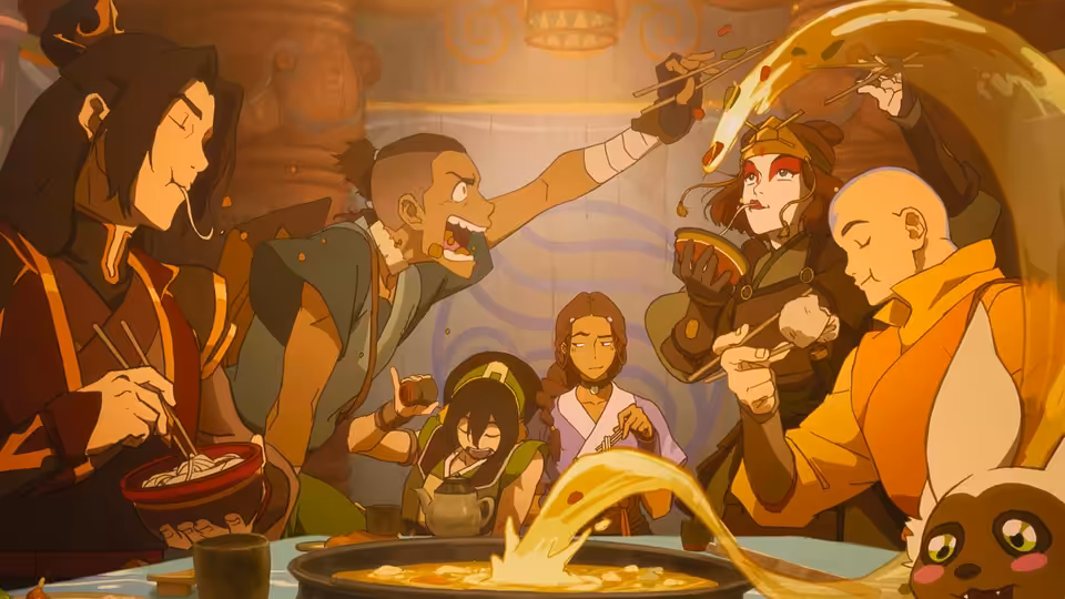 Friends eat noodles at a table as strands fly through the air