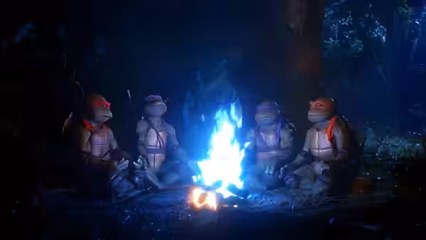 Four masked turtles sit around a blazing campfire in a dark forest