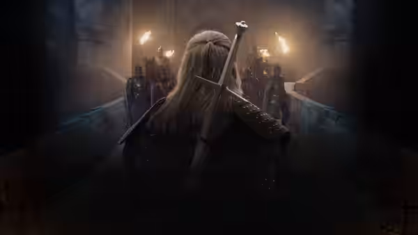 Geralt (Henry Cavill) approaching armored soldiers in a torchlit hall