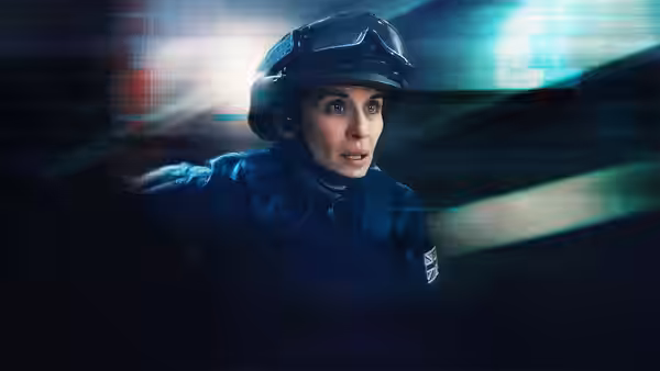 Lana Washington (Vicky McClure) in tactical gear inside vehicle at night