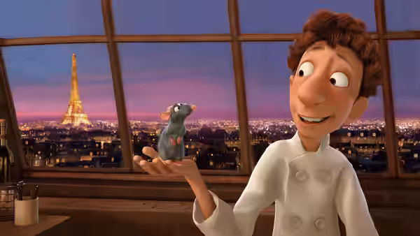 Linguini (Lou Romano) holds Remy in his palm before the Paris skyline