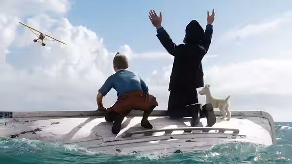 Tintin (Jamie Bell) and Captain Haddock (Andy Serkis) wave from a vessel as an airplane passes overhead