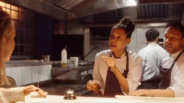 Carly (Vinette Robinson) speaks across the pass while Andy Jones (Stephen Graham) watches