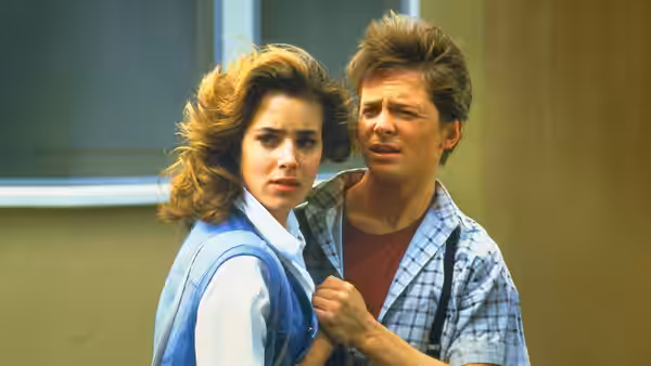 Jennifer Parker (Claudia Wells) standing close to Marty McFly (Michael J. Fox)