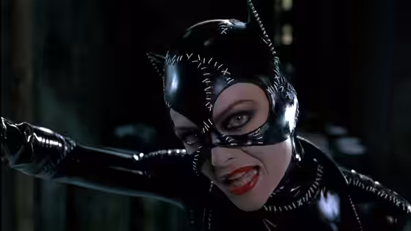 Catwoman (Michelle Pfeiffer) extending her arm forward with mouth open