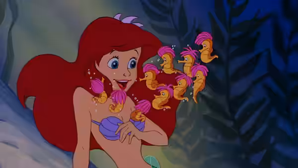 Ariel surrounded by seahorses in an underwater garden
