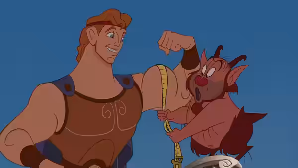 Hercules (Tate Donovan) having his arm measured by Philoctetes (Danny DeVito)