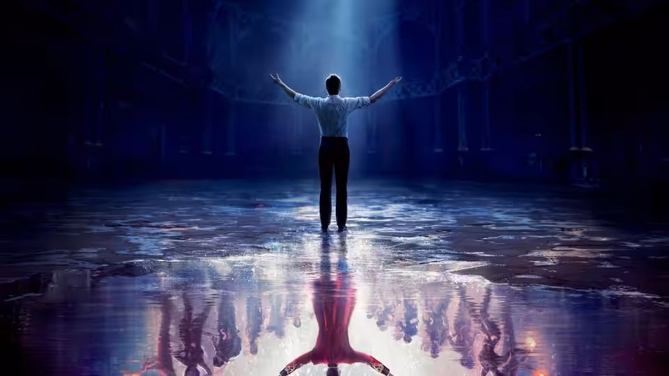P.T. Barnum stands with arms outstretched in a vast empty hall