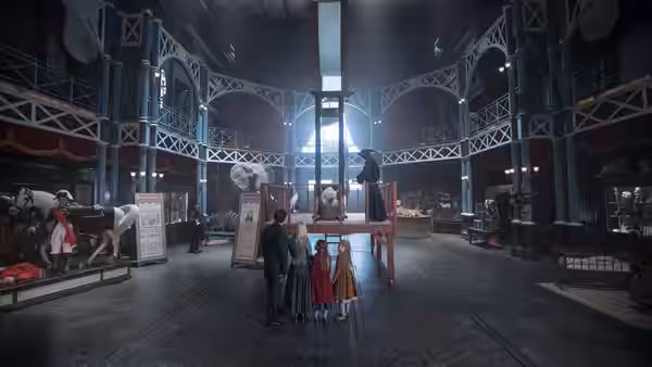 Performers and children gather inside a large circus rehearsal space