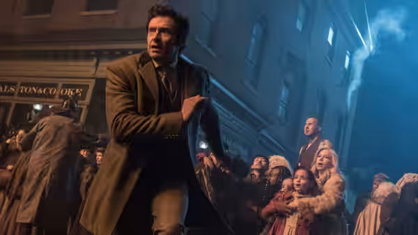 P.T. Barnum runs through a crowded nighttime city street