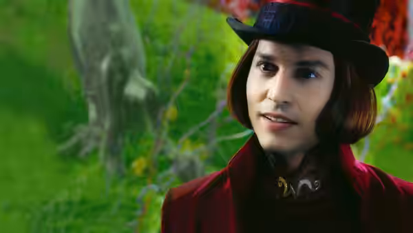 Willy Wonka (Johnny Depp) in a red coat and top hat glances to the side