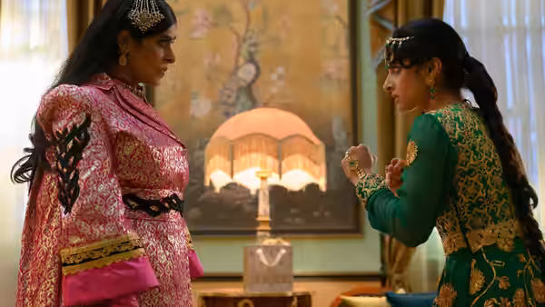 Ria Khan (Priya Kansara) faces Lena (Ritu Arya) in a decorated room
