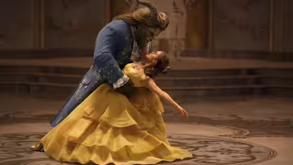 Belle (Emma Watson) and the Beast in a dance dip on a ballroom floor