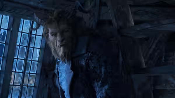 The Beast with horns and fur looking forward near a window