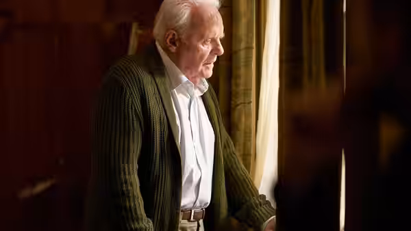Anthony (Anthony Hopkins) stands by a window looking out into the light