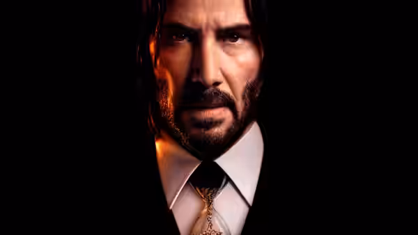 John Wick (Keanu Reeves) in close-up wearing a cross necklace