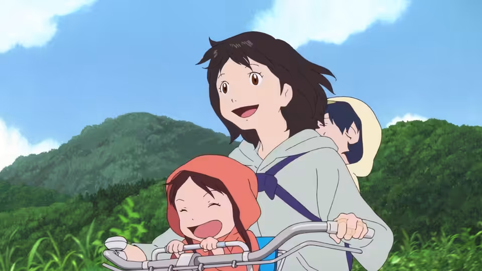 A woman and two children riding a bicycle through green countryside hills
