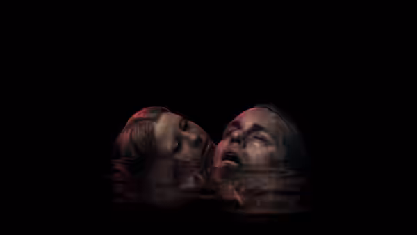 Two women float neck-deep in dark water with heads tilted back