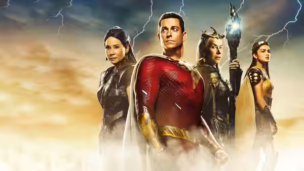 Shazam (Zachary Levi) stands with three women under a stormy sky