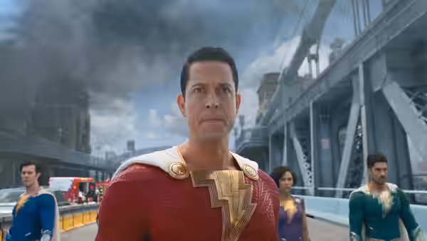 Shazam (Zachary Levi) looks ahead with teammates behind him on a bridge