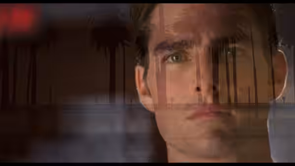 Jerry Maguire (Tom Cruise) with palm trees reflected in the window