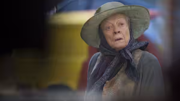 Miss Shepherd (Maggie Smith) looks ahead beneath her wide-brimmed hat and headscarf