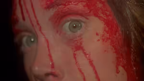 Carrie (Sissy Spacek) with blood streaming down her face and eyes