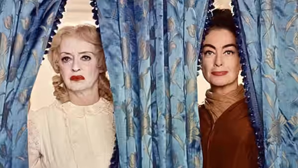 Blanche Hudson (Joan Crawford) and Baby Jane Hudson (Bette Davis) peer through parted curtains