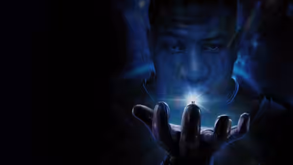 Kang the Conqueror examining a small glowing figure on his fingertip