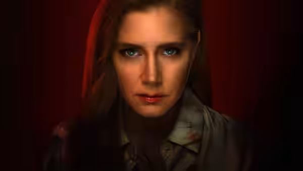 Anna Bowden (Amy Adams) gazes ahead with a serious expression