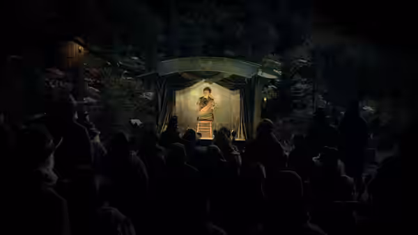 Buster Scruggs (Tim Blake Nelson) singing on a lantern-lit wooden stage to a crowd